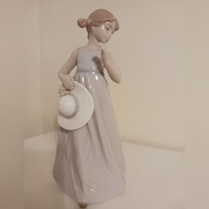 Nadal Porcelain Girl Holding Hat Figurine